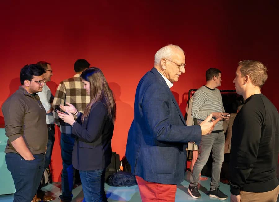 Co-hosts and guests in conversation at a JazzClub event
